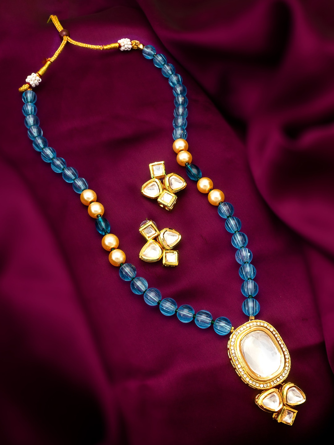 

aadita Gold-Plated Stone-Studded & Beaded Jewellery Set