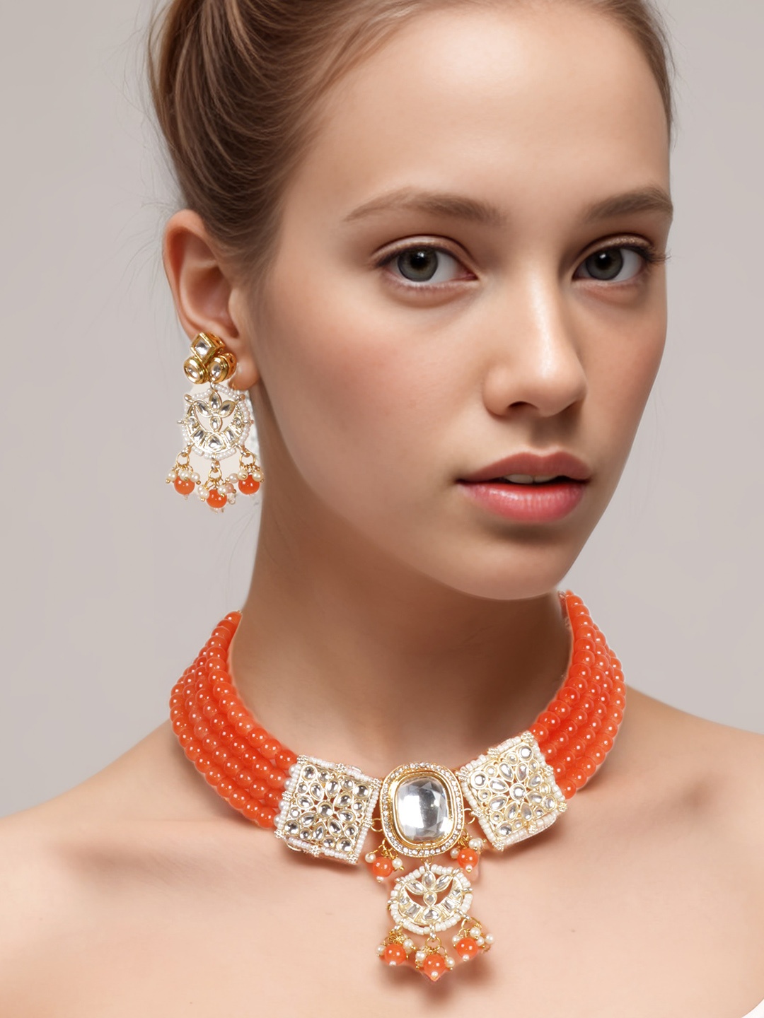 

aadita Gold-Plated Stones Studded & Beaded Jewellery Set