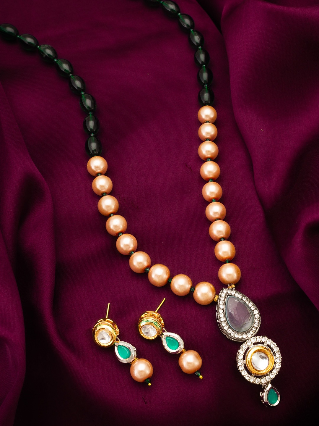 

aadita Gold-Plated Stone-Studded & Beaded Jewellery Set