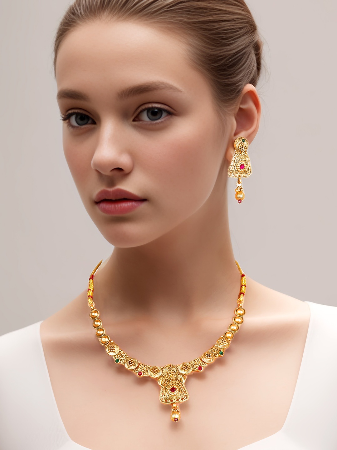 

aadita Gold-Plated Stones Studded Jewellery Set