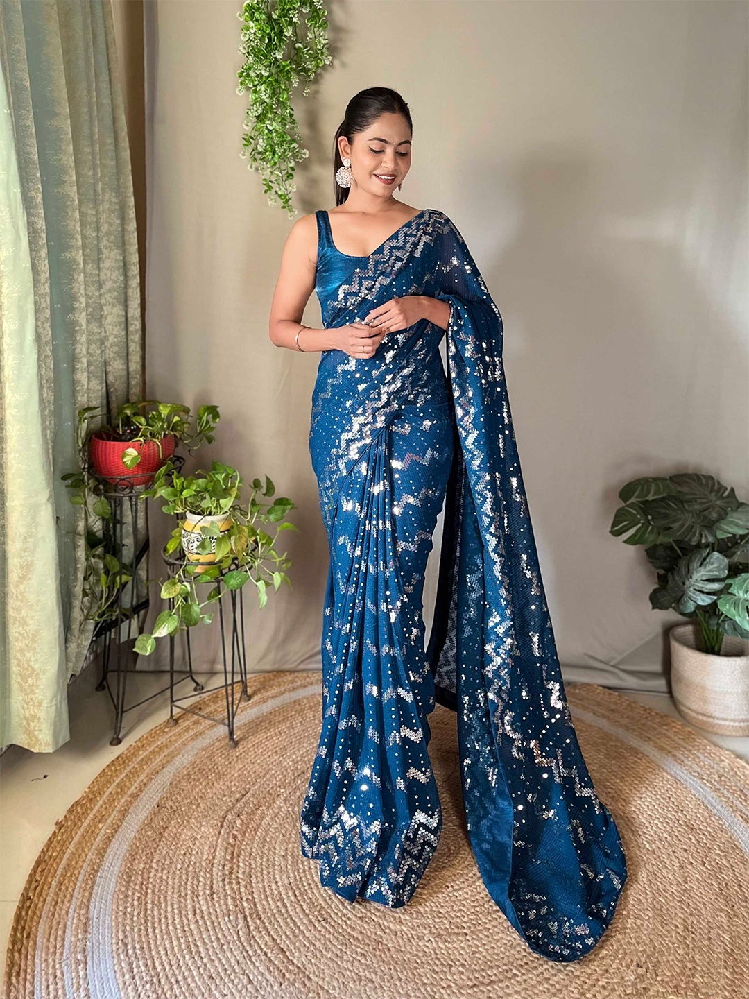 

Mitera Teal Embellished Sequinned Poly Georgette Saree
