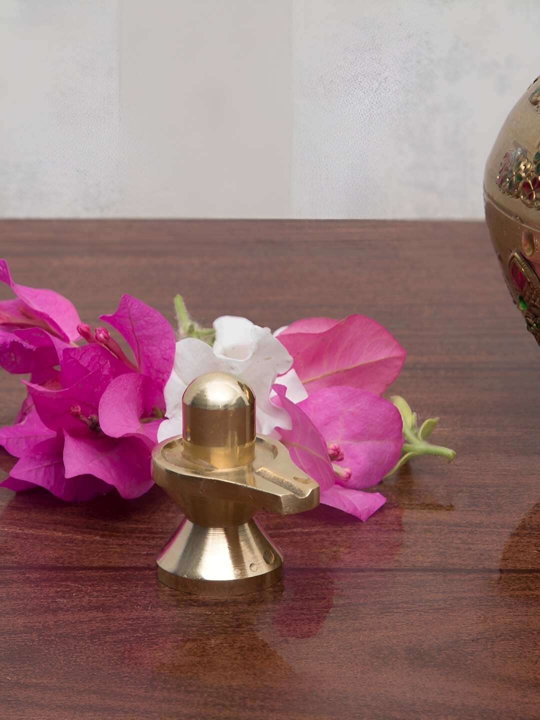 

Aakrati Yellow Brass Small Shivling Religious Idol Showpiece