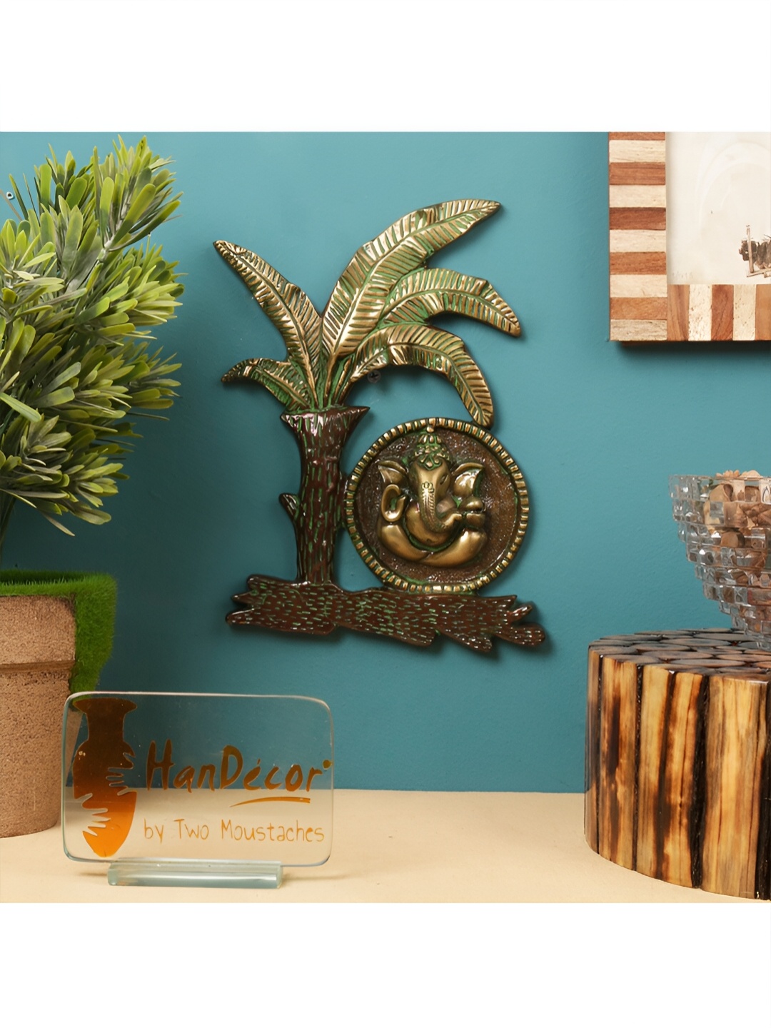 

Two Moustaches Gold-toned Brass Ganesha Under Banana Tree Hanging Wall Decor
