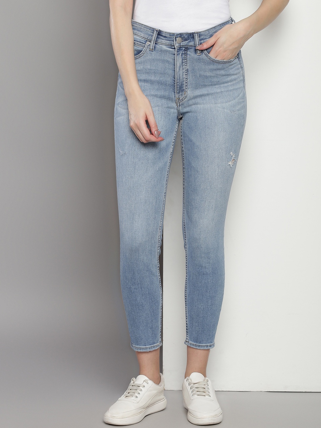 

Calvin Klein Women Skinny Fit Low Distress Light Fade Jeans, Blue