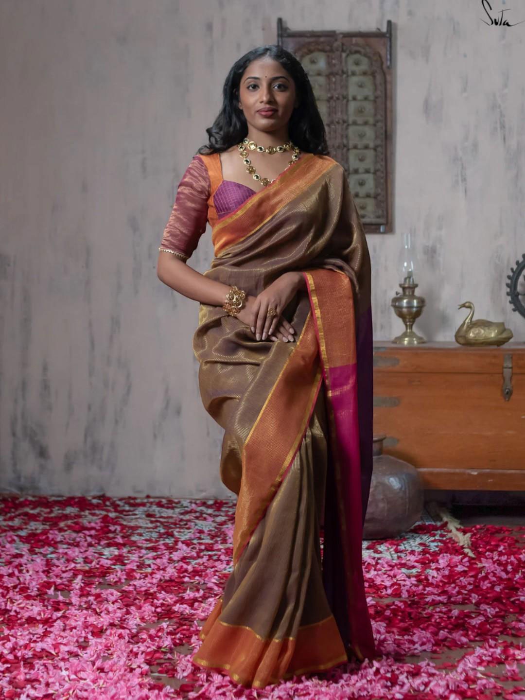 

Suta Brown Woven Design Zari Saree