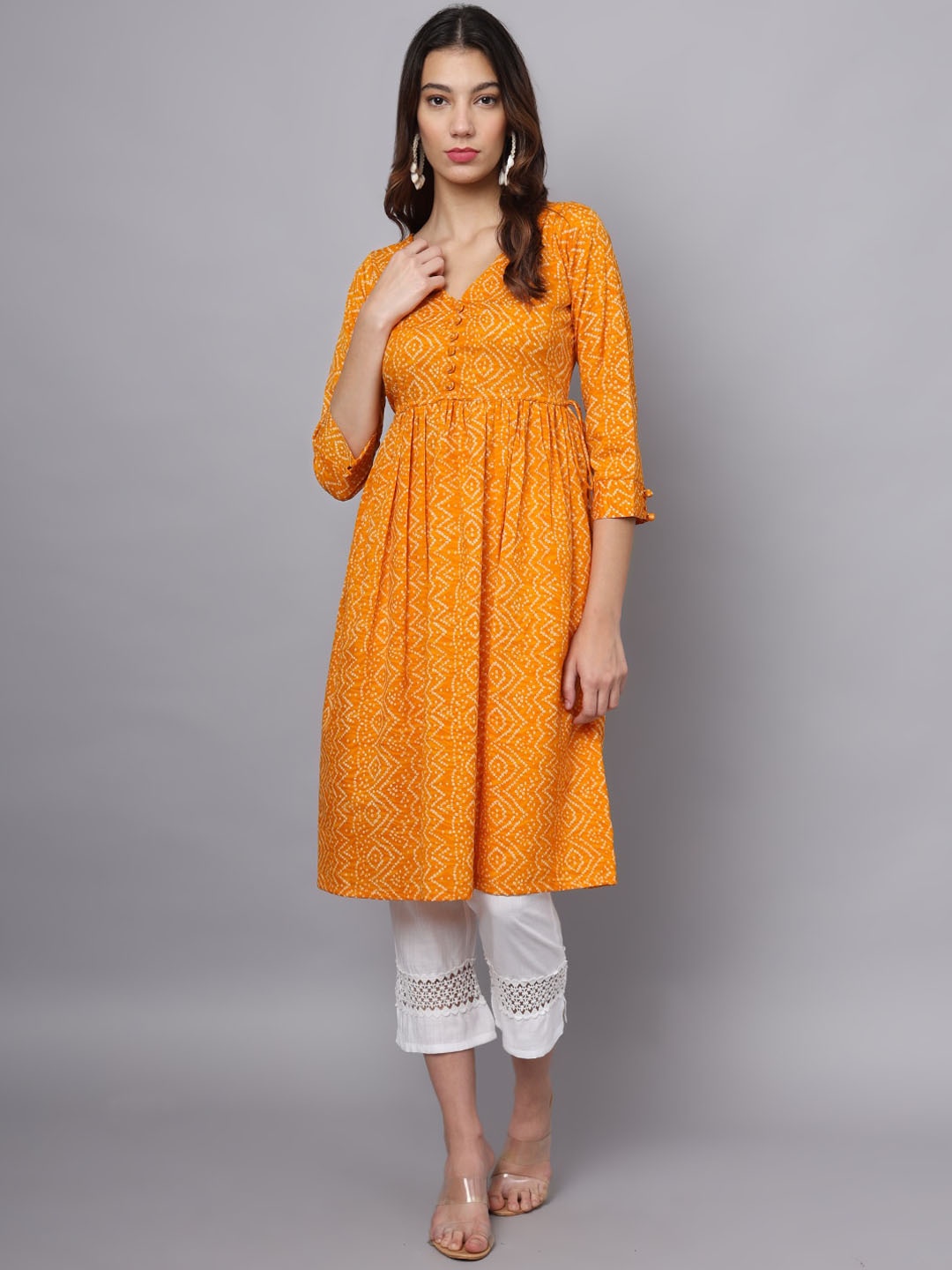 

Ojjasvi Bandhani Printed Empire Kurta & Trousers, Mustard