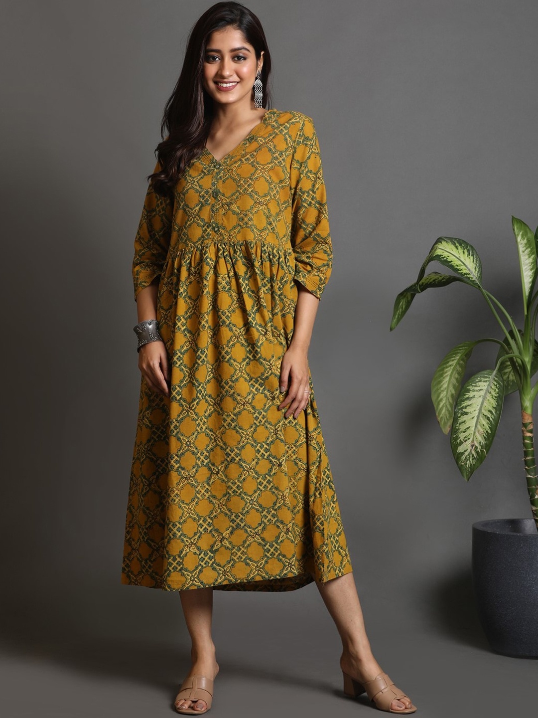 

Earthwear Women Ethnic Motifs Printed Flared Sleeves Chikankari Kurta, Mustard