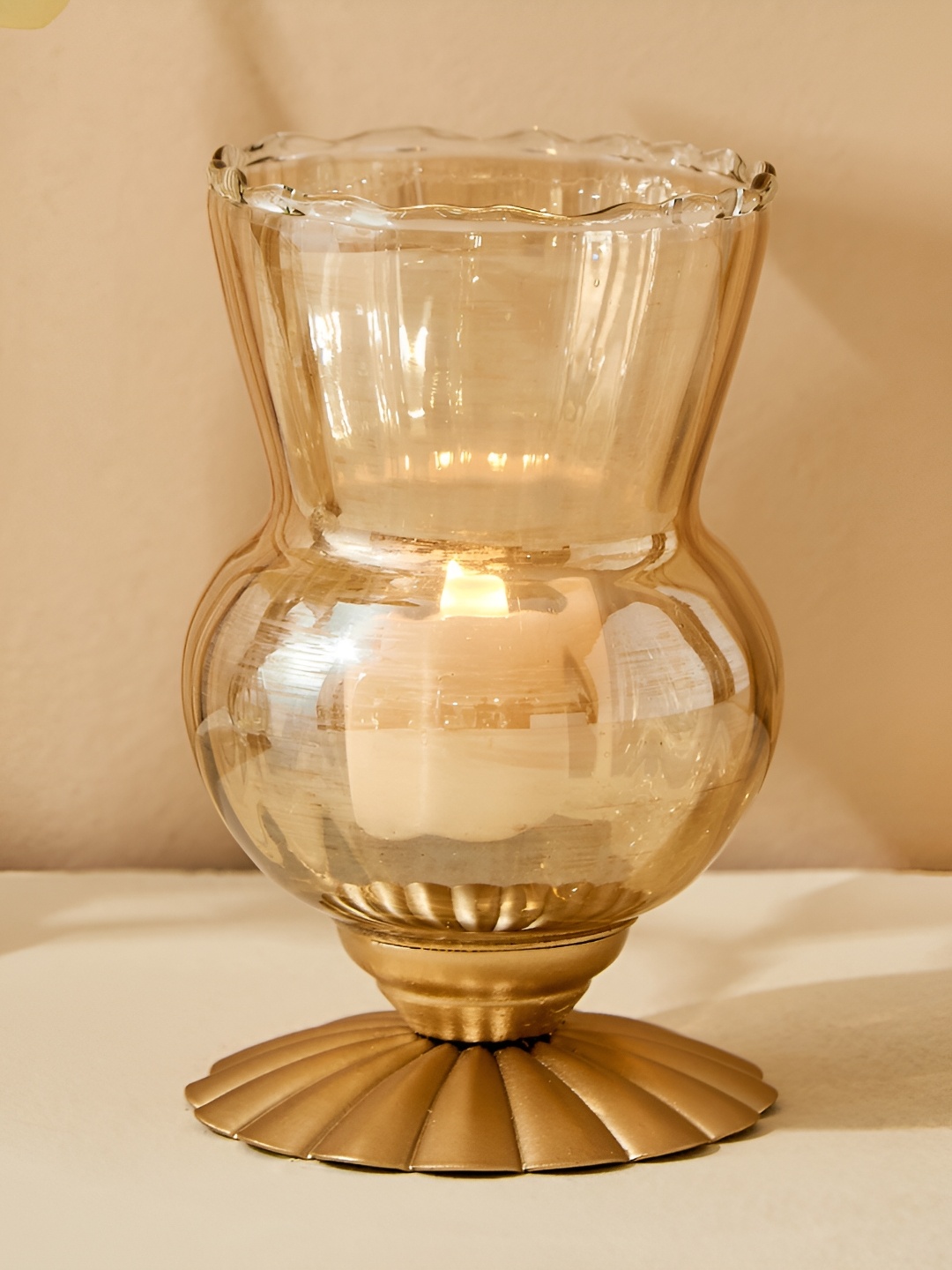 

Home Centre Gold-Toned Glass Hurricane Candle Holder