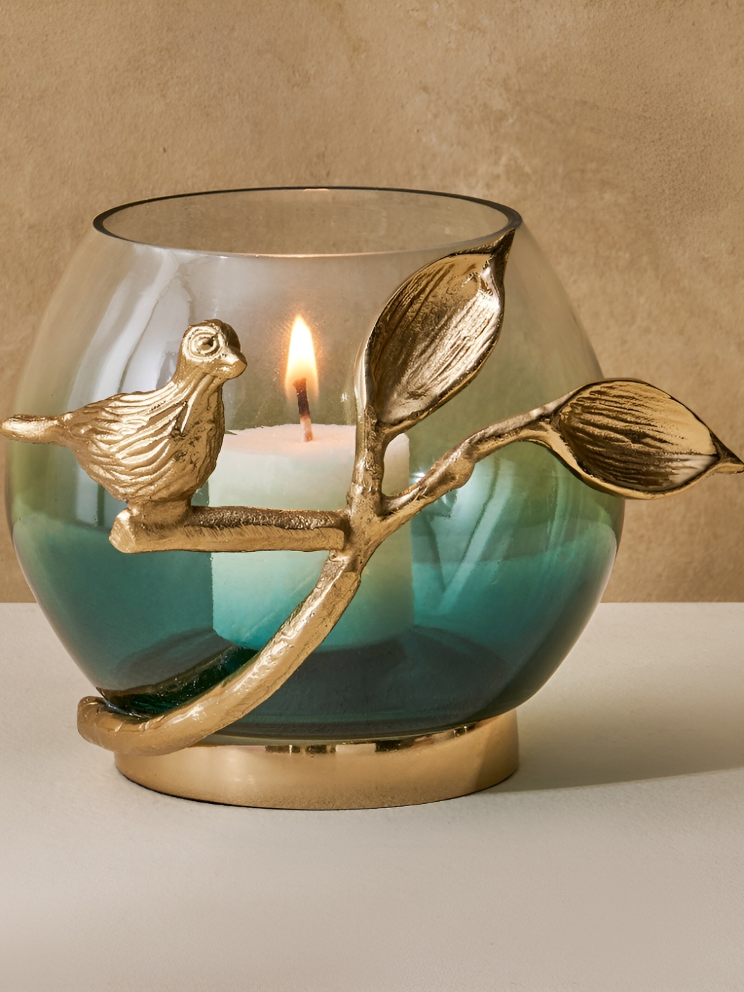 

Home Centre Green Glass Bird Votive Holder