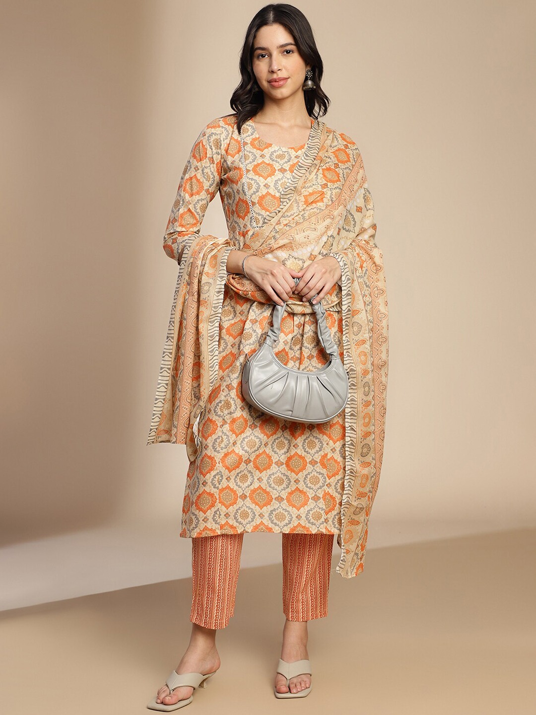 

Shaily Orange Ethnic Motifs Printed Pleated A-Line Kurta With Trousers & Dupatta