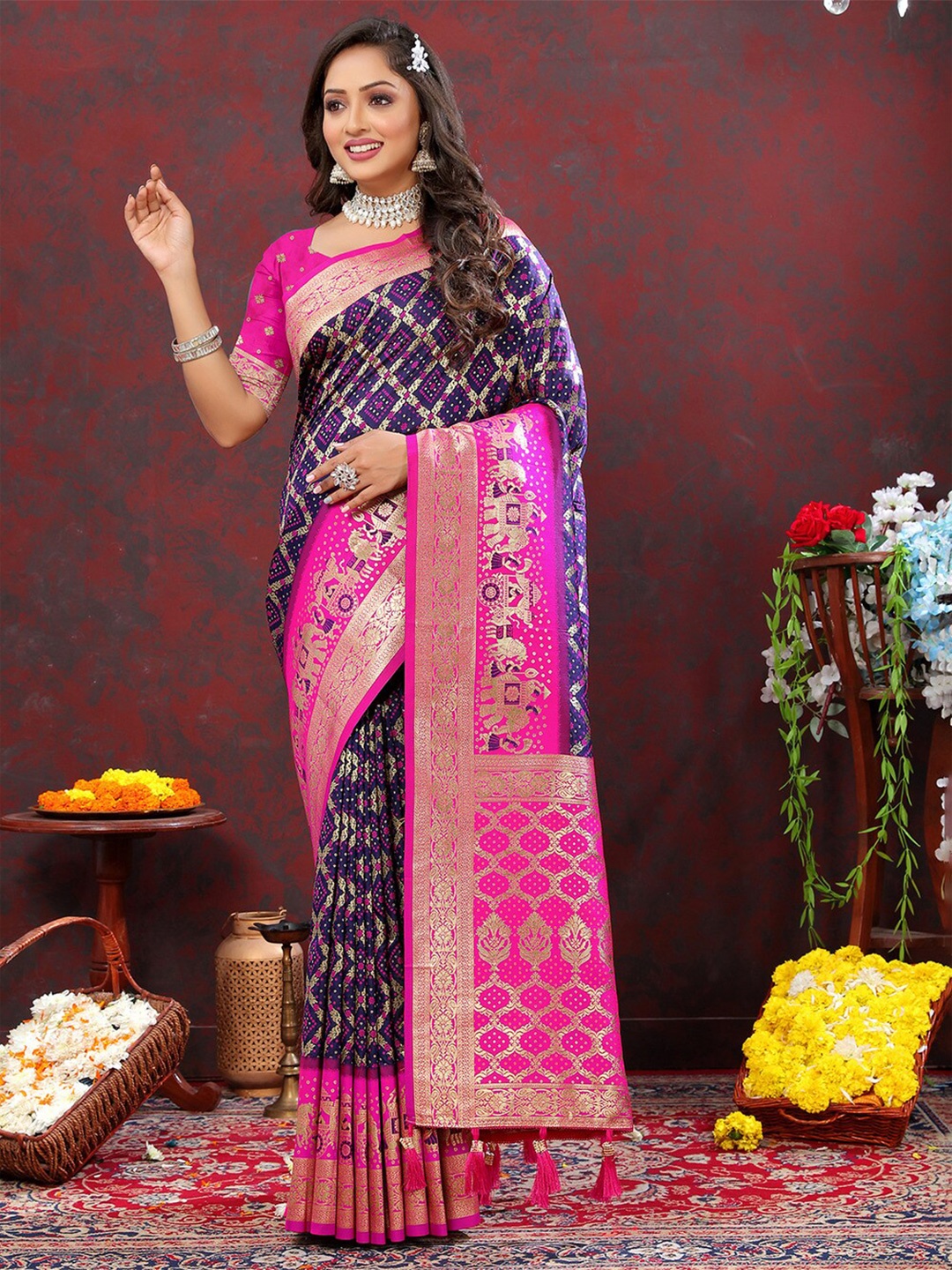 

Mitera Purple & Pink Ethnic Motifs Woven Design Zari Patola Saree