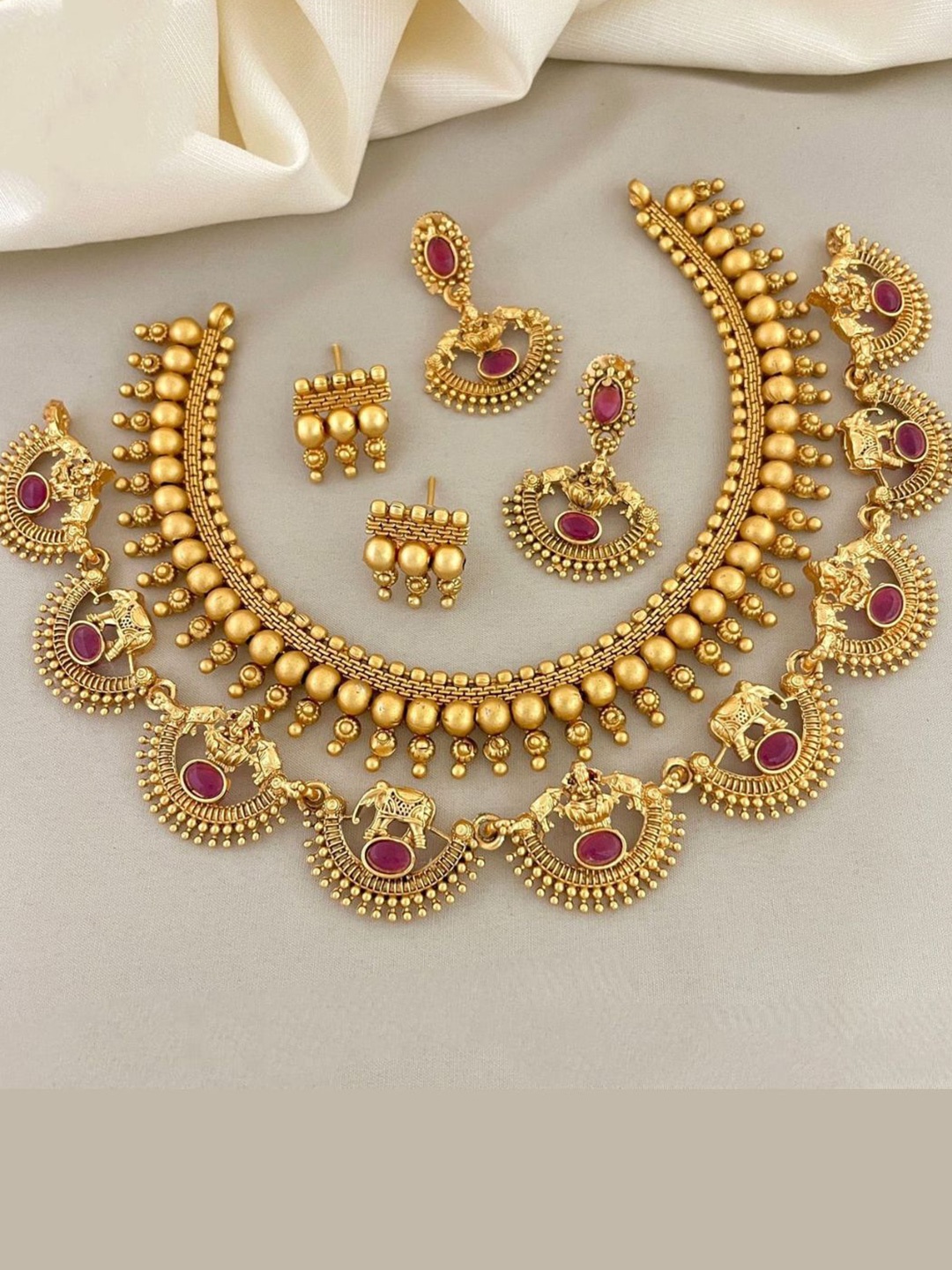

Adc fashions Gold-Plated Artificial Stones Studded Temple Necklace With 2 Pairs Earrings, Red