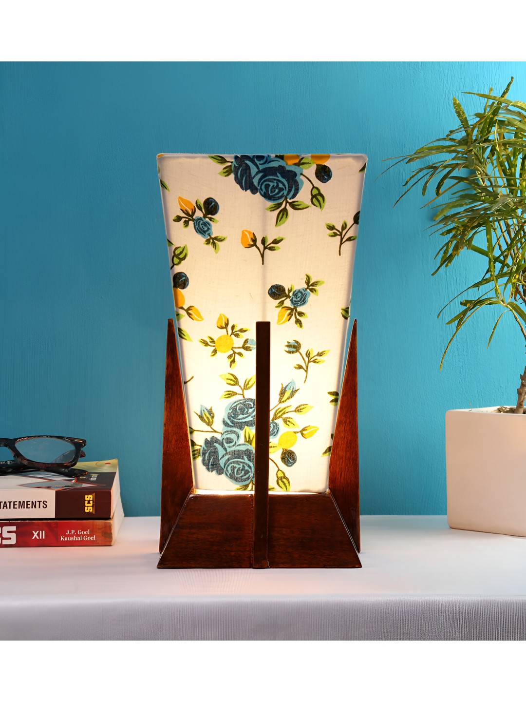 

Devansh White Wooden Printed Contemporary Triangle Shaped Table Lamp