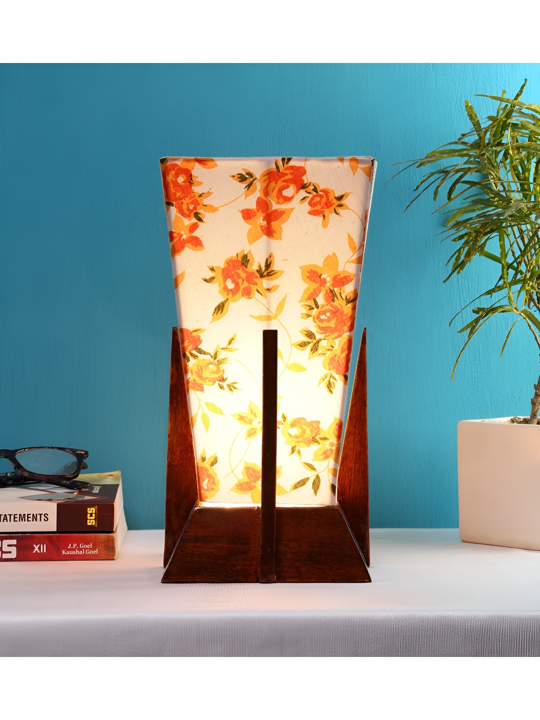 

Devansh White Wooden Printed Contemporary Triangle Shaped Table Lamp