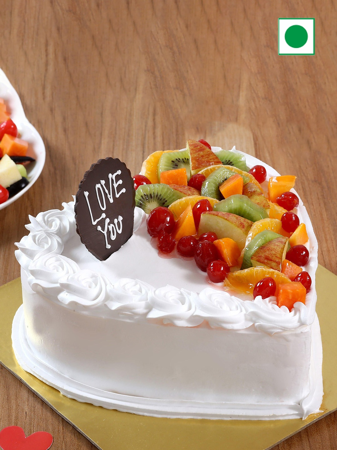 

fnp Vanilla Fruit Flavor Eggless Heart Shaped Cake 500gms, White