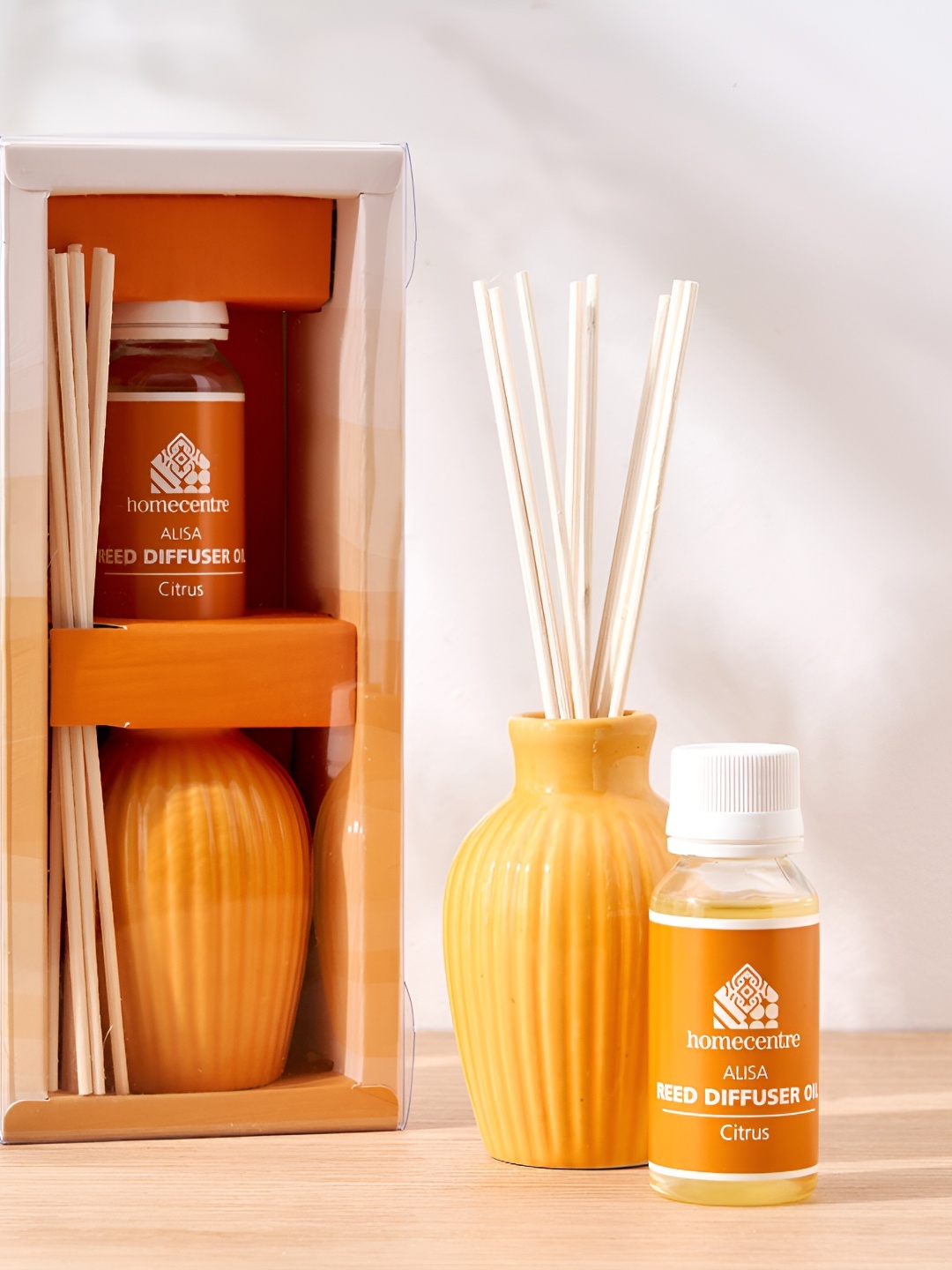 

Home Centre Alisa Yellow & White Textured Ceramic Citrus Reed Diffuser Set