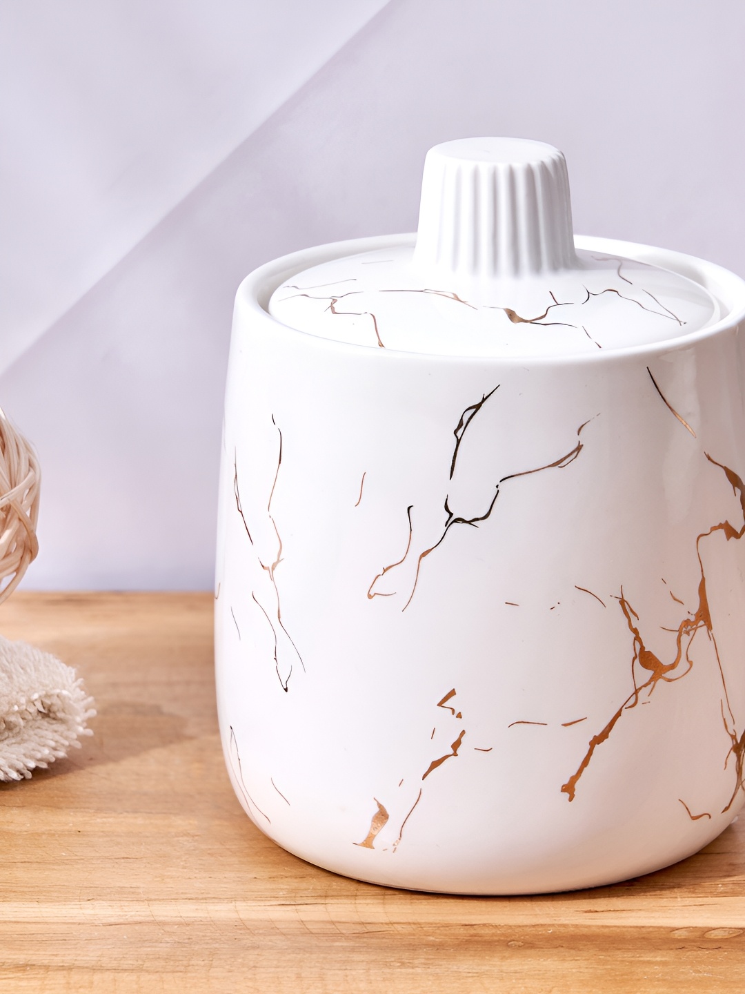 

Home Centre White & Gold-Toned Abstract Ceramic Cotton Jar