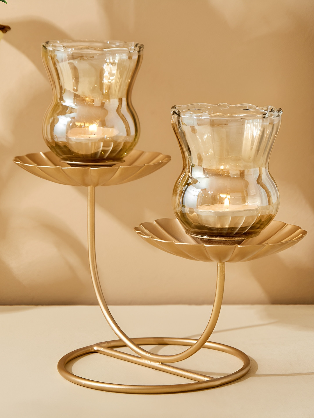 

Home Centre Gold-Toned Glass Flower Multi T-Light Candle Holder