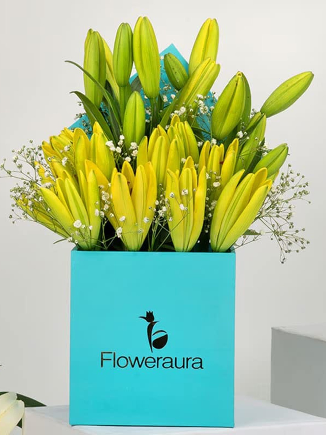 

Floweraura Bunch Of 6 Yellow Lilies Fresh Live Flowers Bouquet In Blue Box