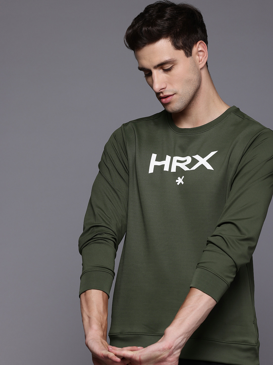 

HRX by Hrithik Roshan Solid Regular Sweatshirt, Green