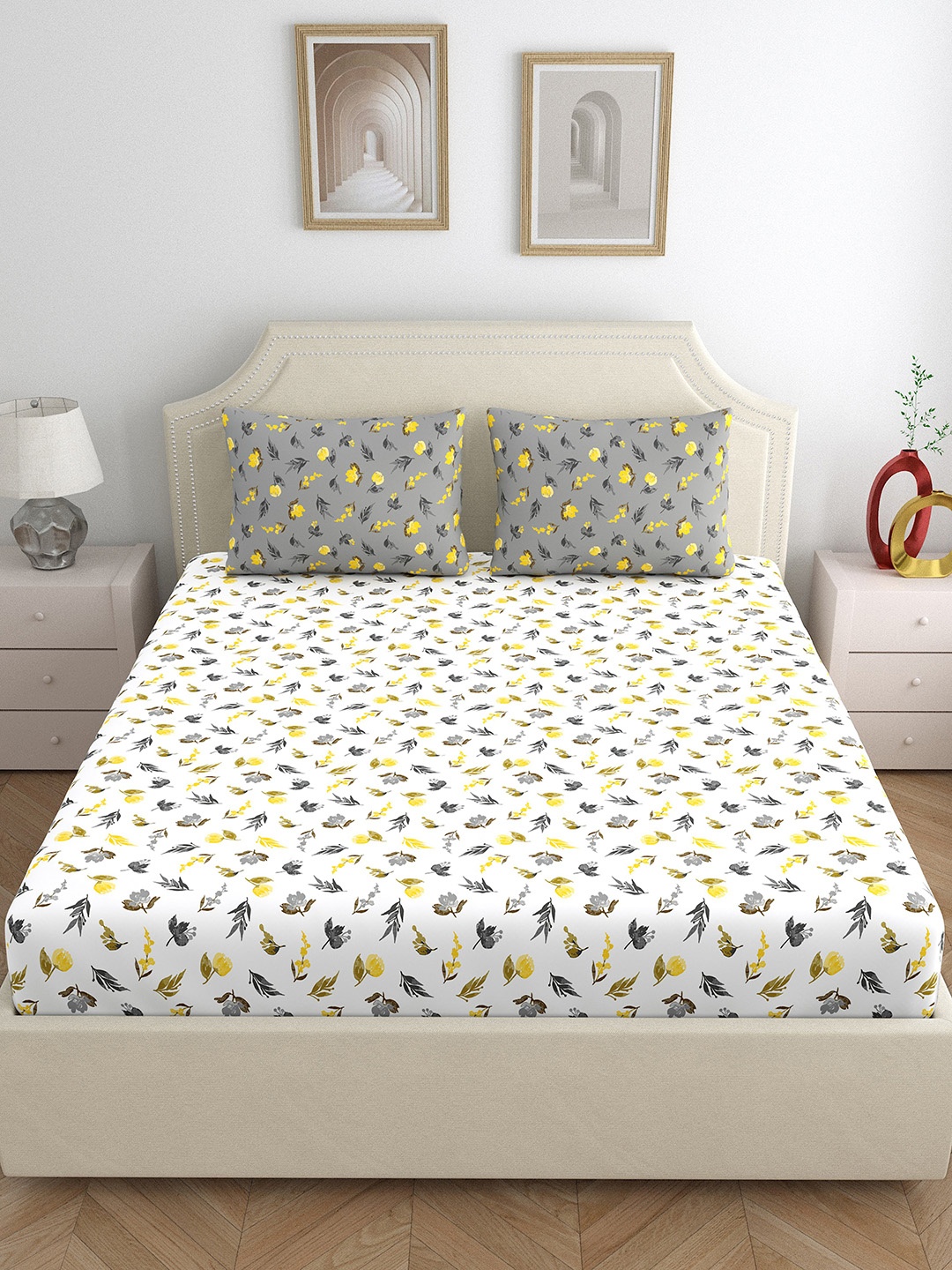 

Home Ecstasy Grey & White Floral 140 TC Cotton Queen Bedsheet with 2 Pillow Covers