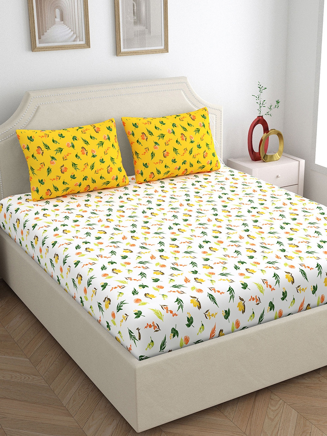 

Home Ecstasy Yellow & White Floral 140 TC Cotton Queen Bedsheet with 2 Pillow Covers