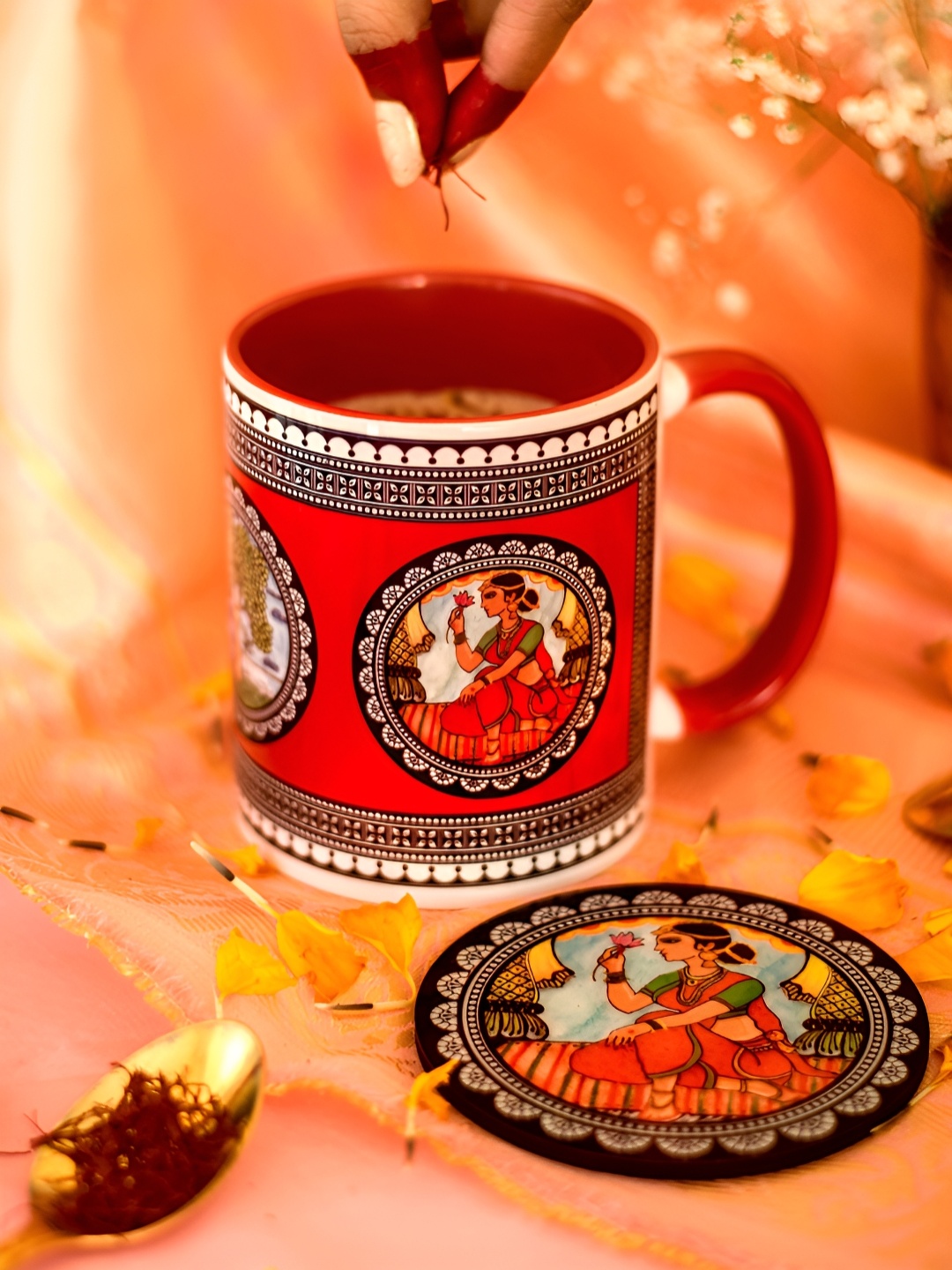 

Strokes by Namrata Mehta Red Ethnic Motifs Printed Ceramic Glossy Mugs with Coaster