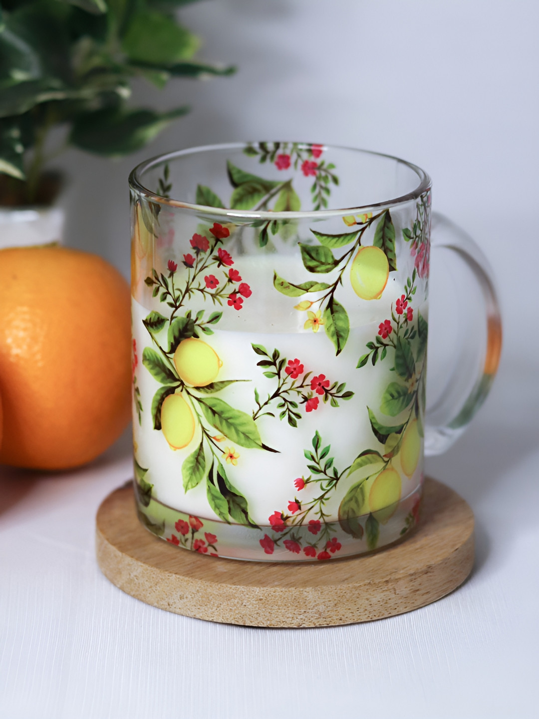 

Strokes by Namrata Mehta Yellow Printed Glass Mug 350 ml, Transparent