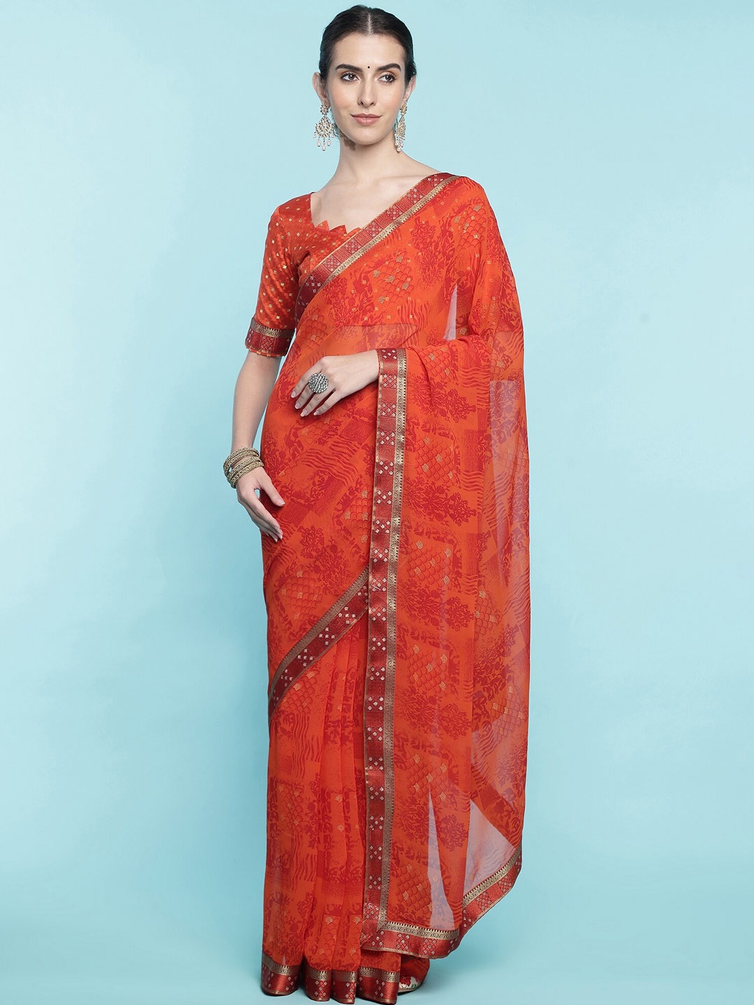 

Mitera Orange Floral Printed Zari Pure Georgette Saree
