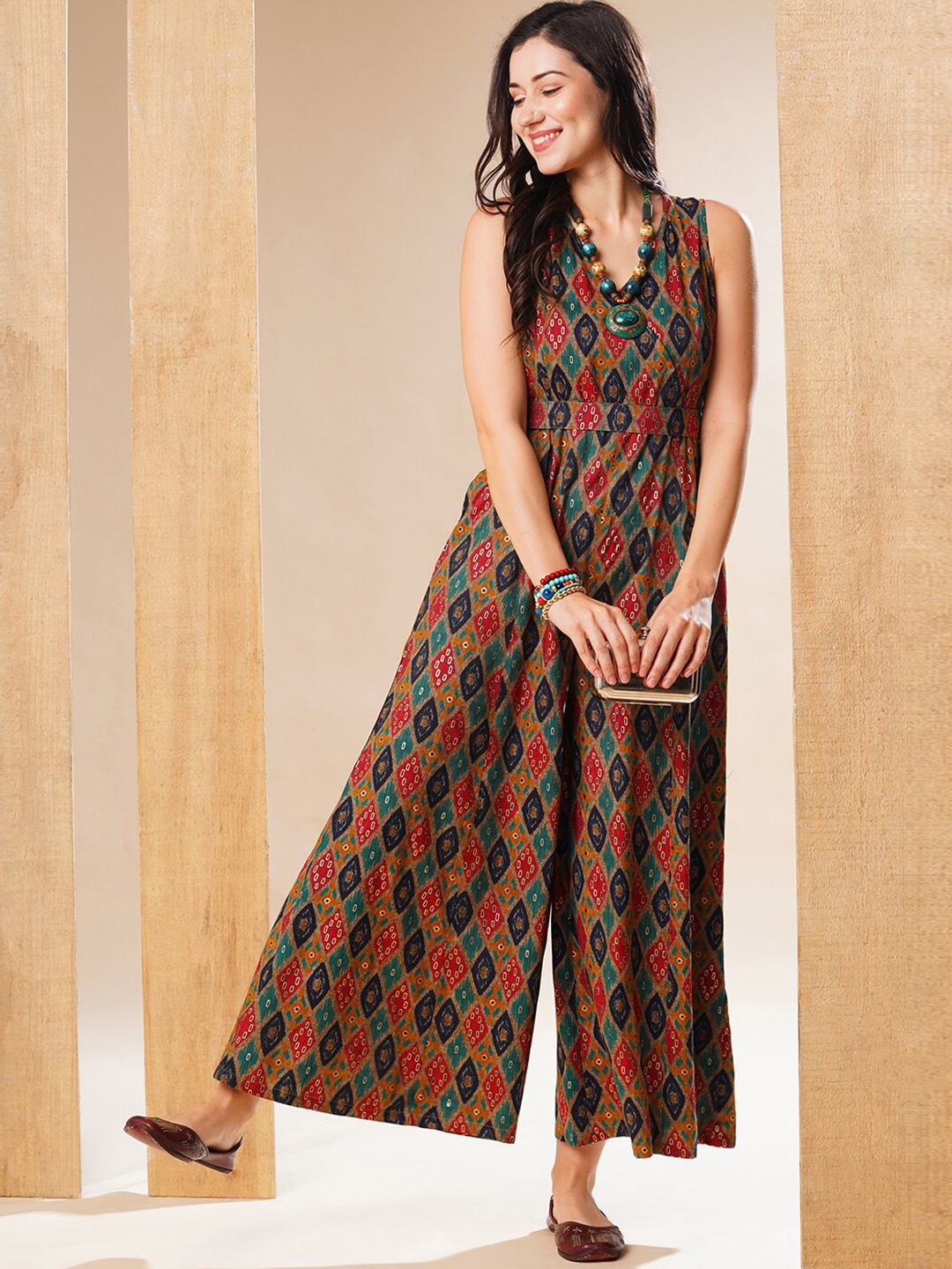 

Globus Ethnic Gold Foil Printed Wrap Neck Belted Flared Leg Fusion Jumpsuit, Green