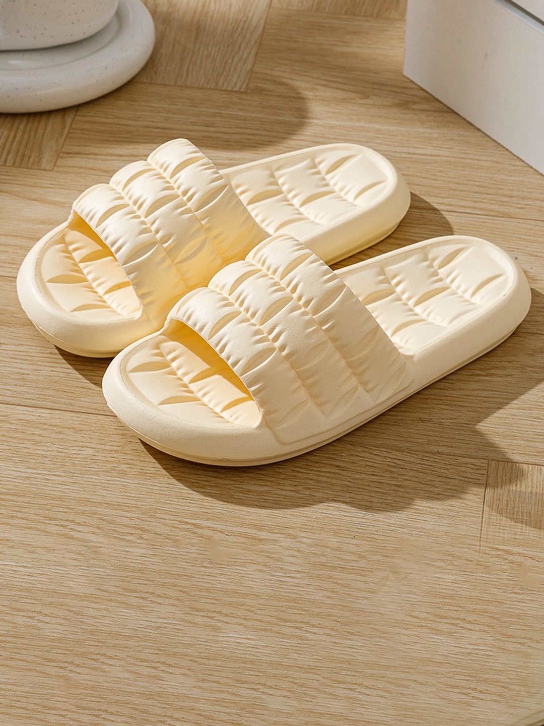 

Alexvyan Women Self Design Croslite Sliders, Yellow