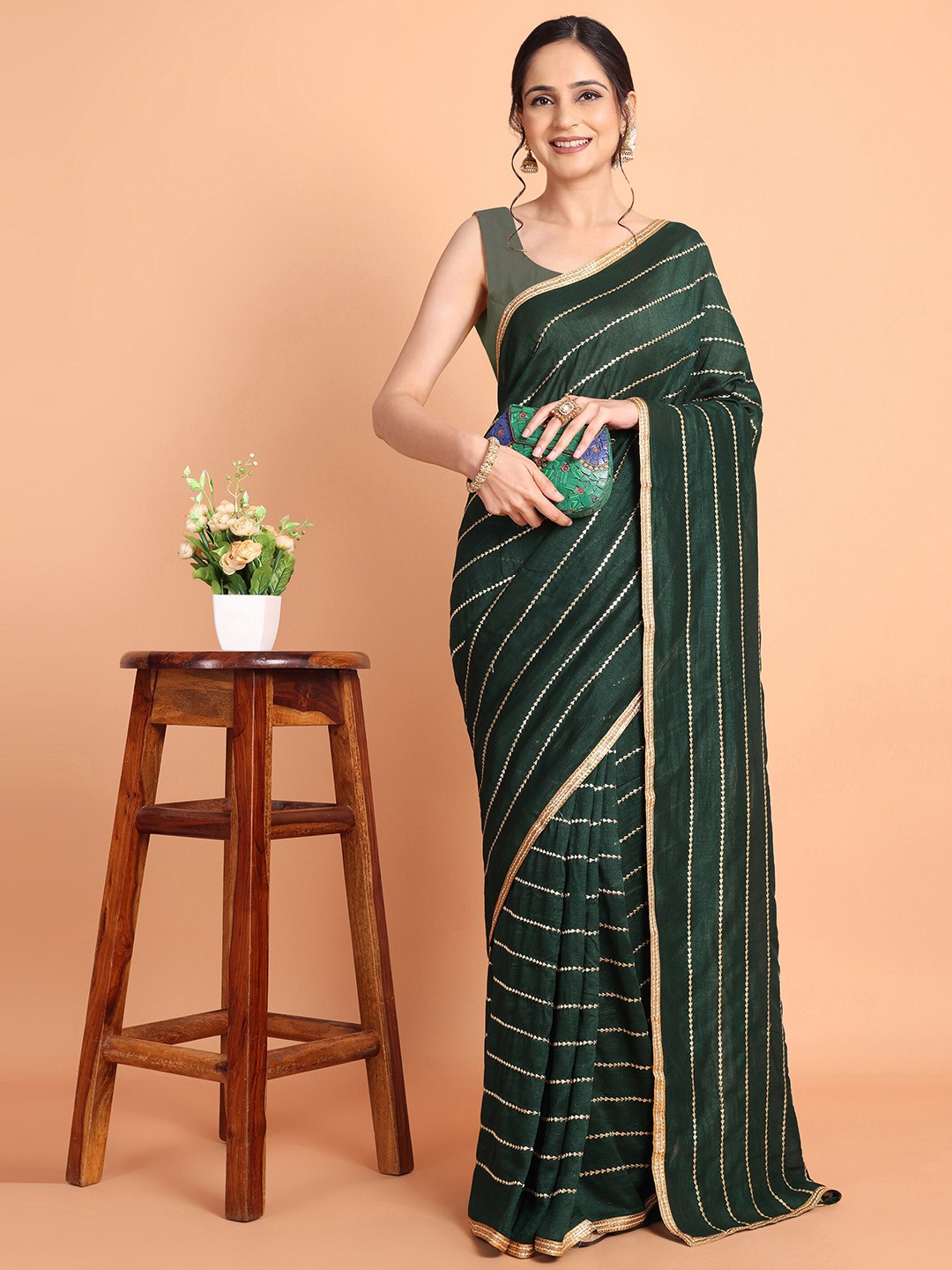 

Mitera Green Striped Embroidered Saree