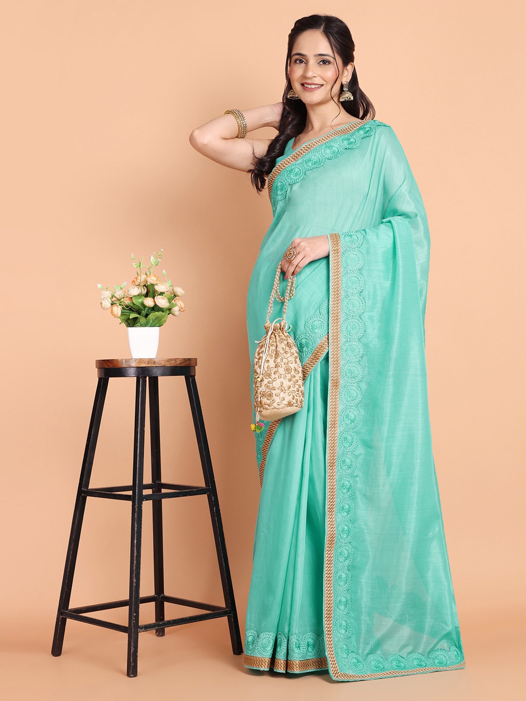 

Mitera Turquoise Blue Embroidered Border Saree