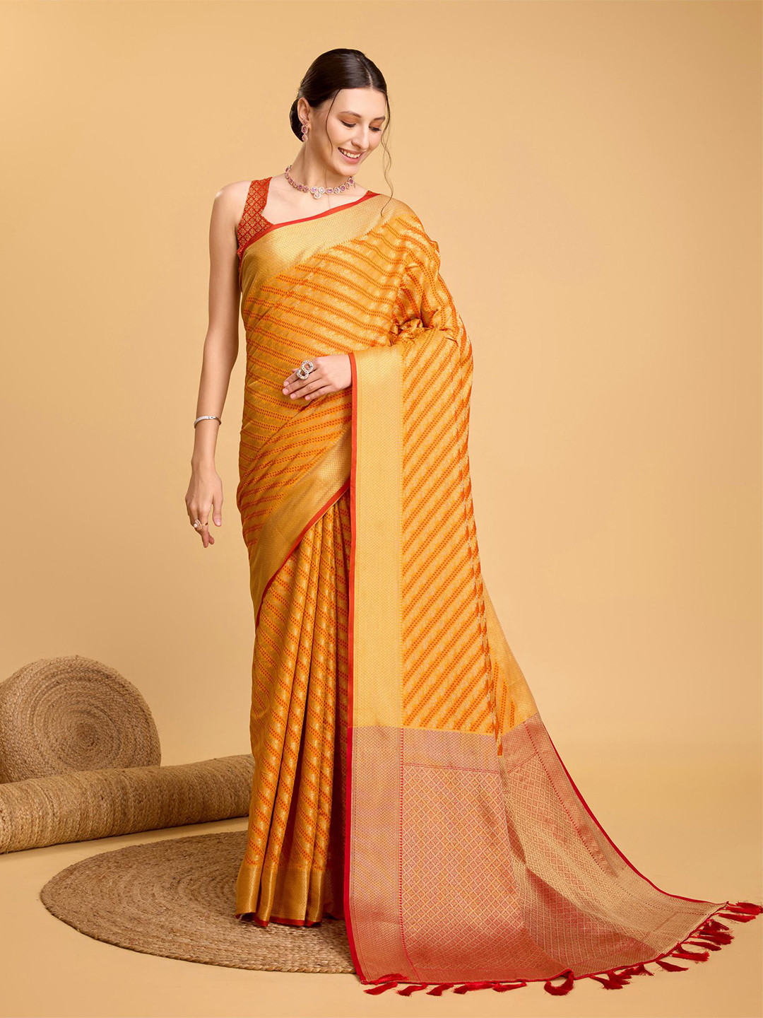 

Mitera Yellow Floral Woven Design Zari Patola Saree
