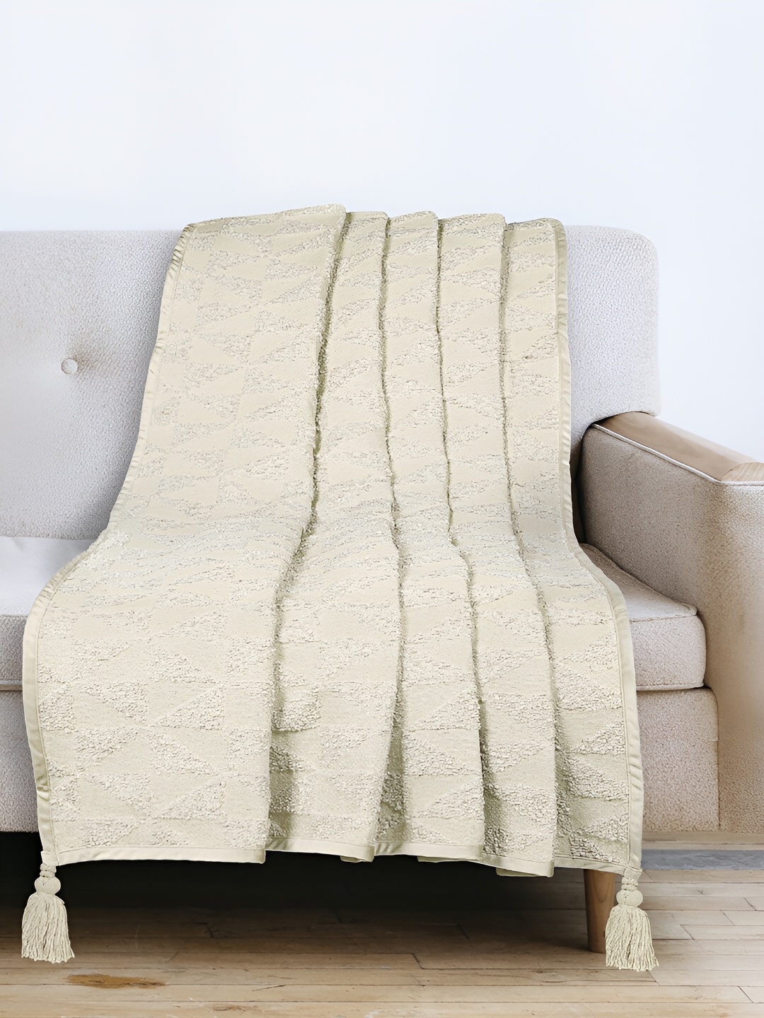 

Saral Home Beige Self Design Sofa Throws