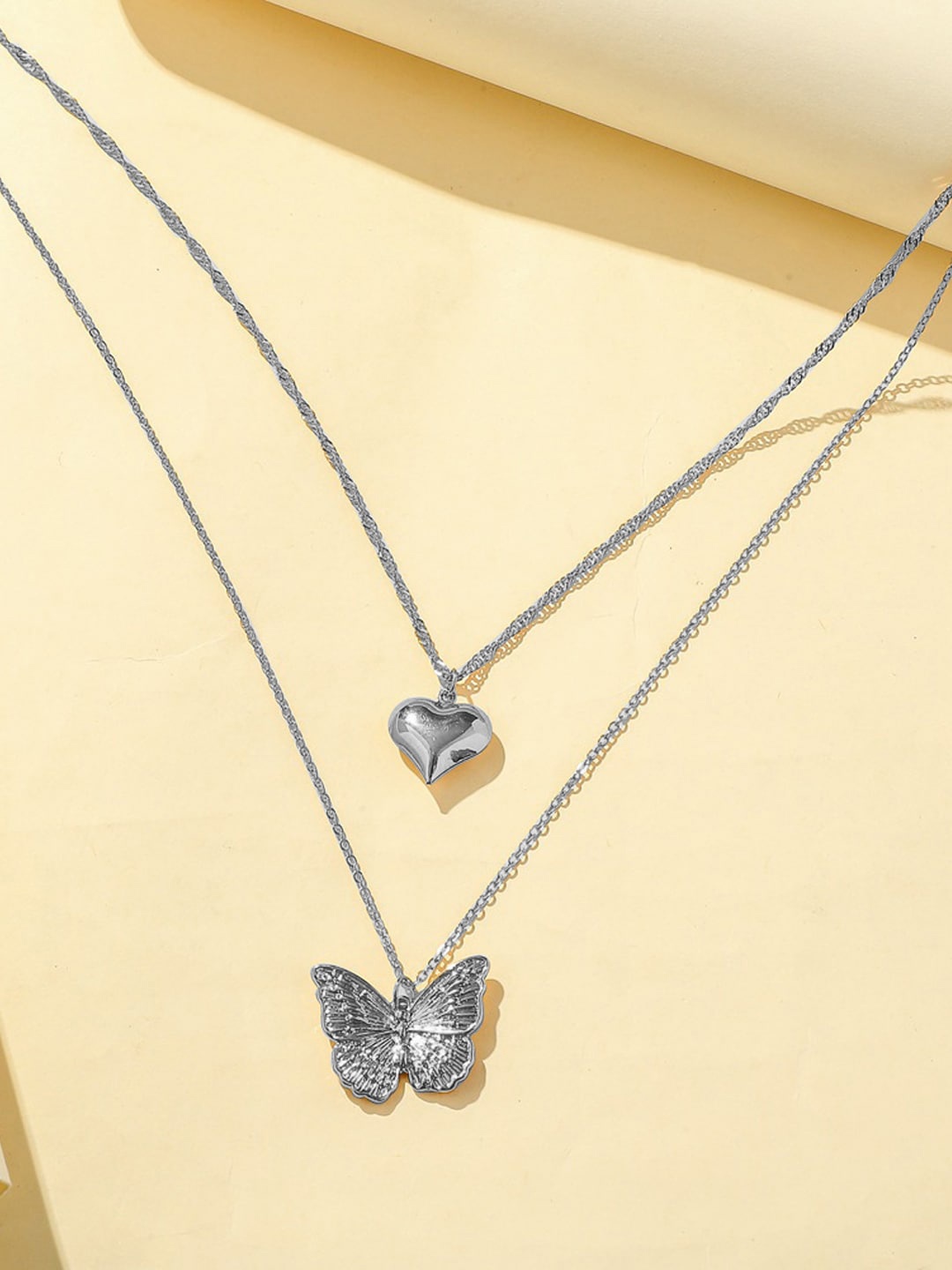 

Krelin Silver Plated Butterfly & Heart Shaped Layered Necklace