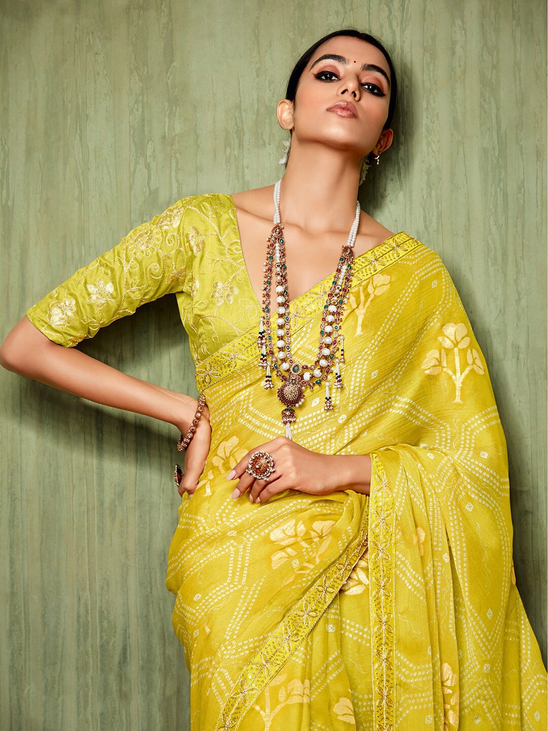 

Mitera Yellow Bandhani Printed Sequinned Pure Chiffon Saree