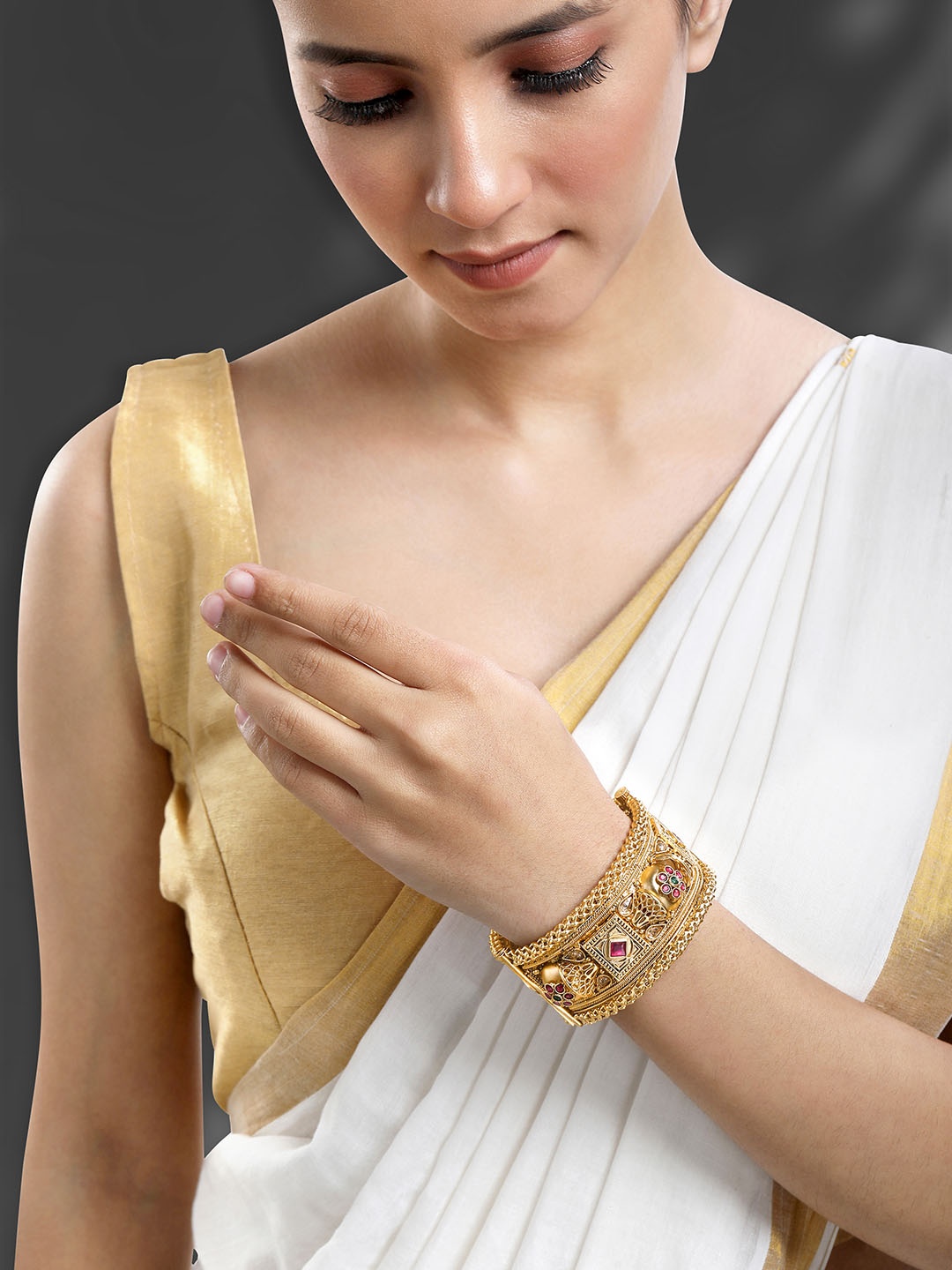 

Peora Gold-Plated Artificial Stones Studded Bangle