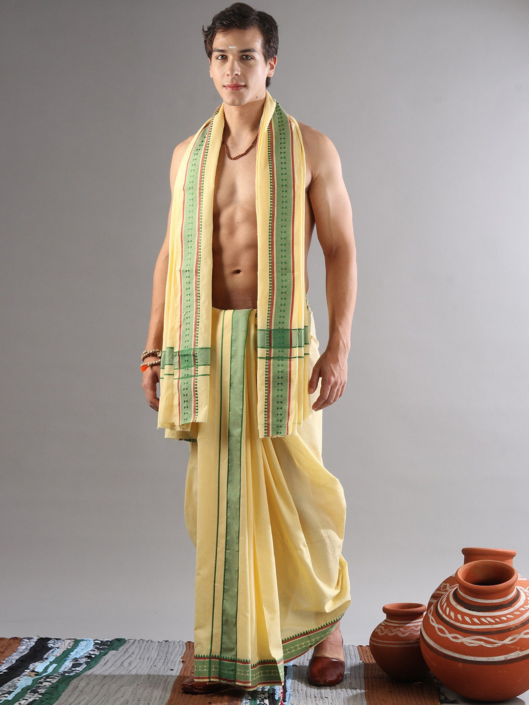 

Exotic India Pure Cotton Dhoti With Angavastram Set, Yellow
