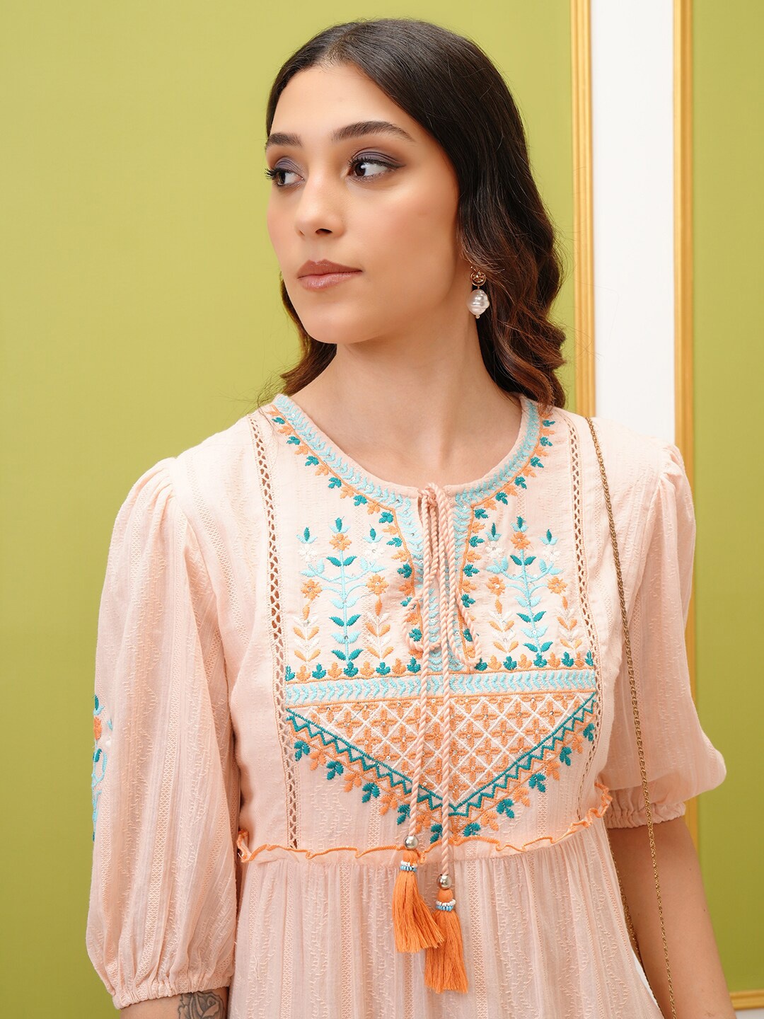 

Vishudh Peach Tie-Up Neck Puff Sleeves Cotton A-Line Tiered Dress
