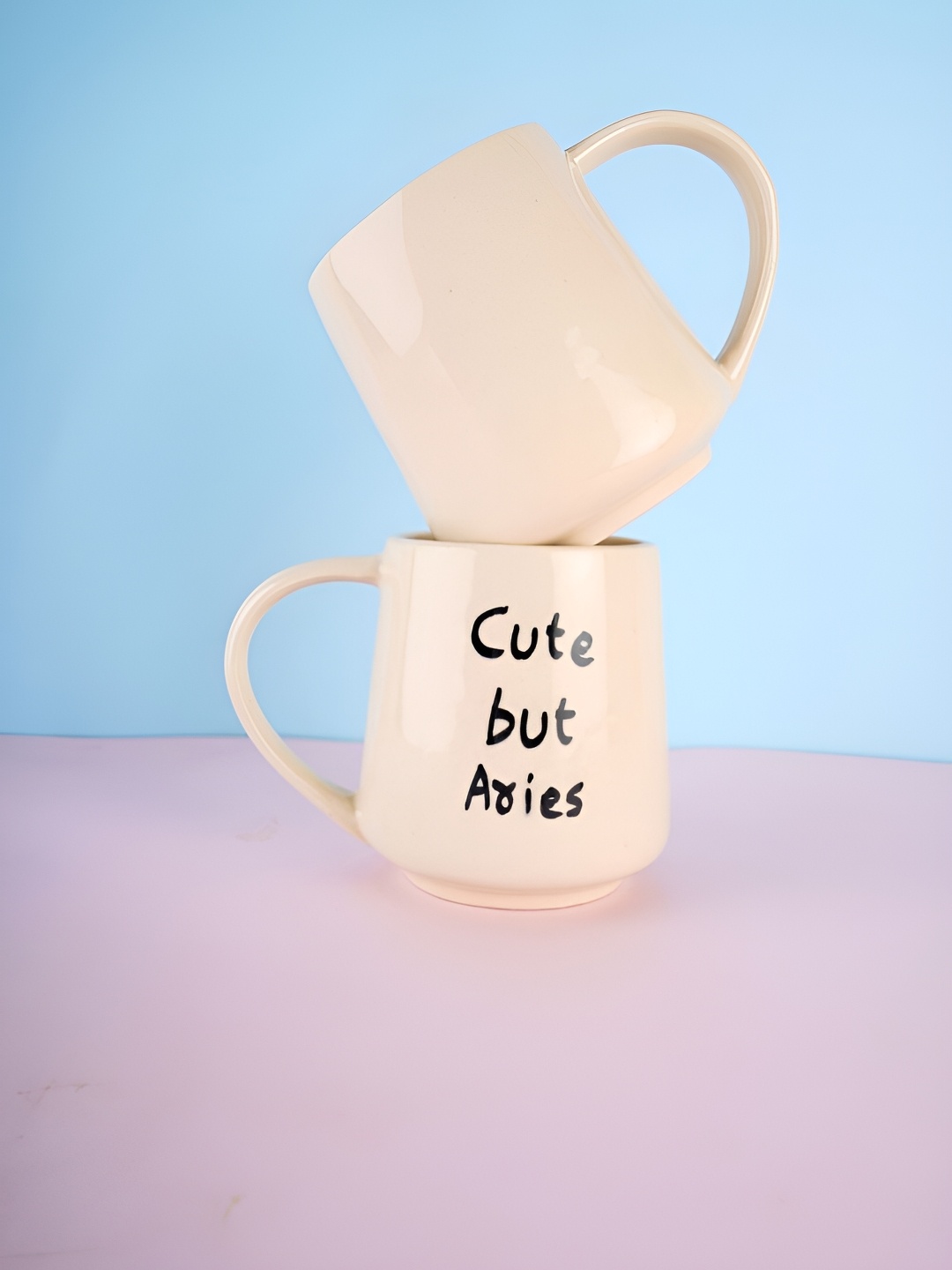 

WEAVING HOMES Cream & Black 2 pieces Printed Ceramic Glossy Mugs 250 ml Each
