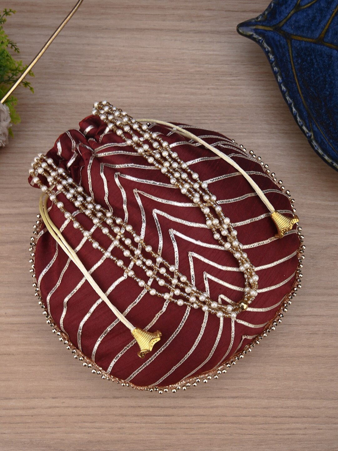 

Anouk Maroon Striped Potli Clutch