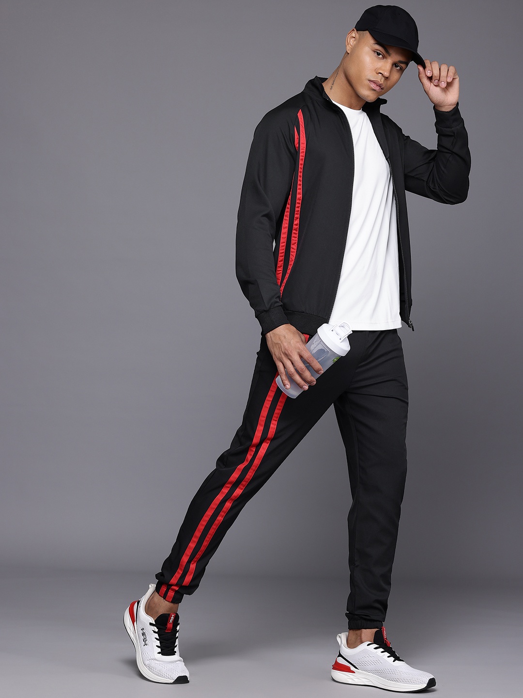 

HRX by Hrithik Roshan Men Striped Rapid-Dry Sports Lifestyle Tracksuit, Black