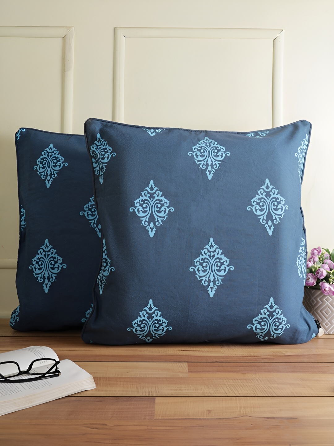 

Aura Blue & Navy Blue 2 Pieces Ethnic Motifs Square Cushion Covers