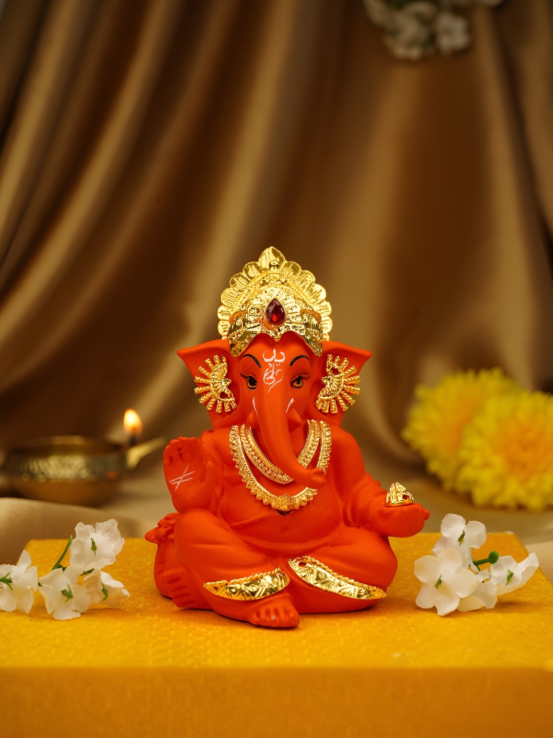 

Ekhasa Orange Tiny Ganesh Idol Religious Showpiece