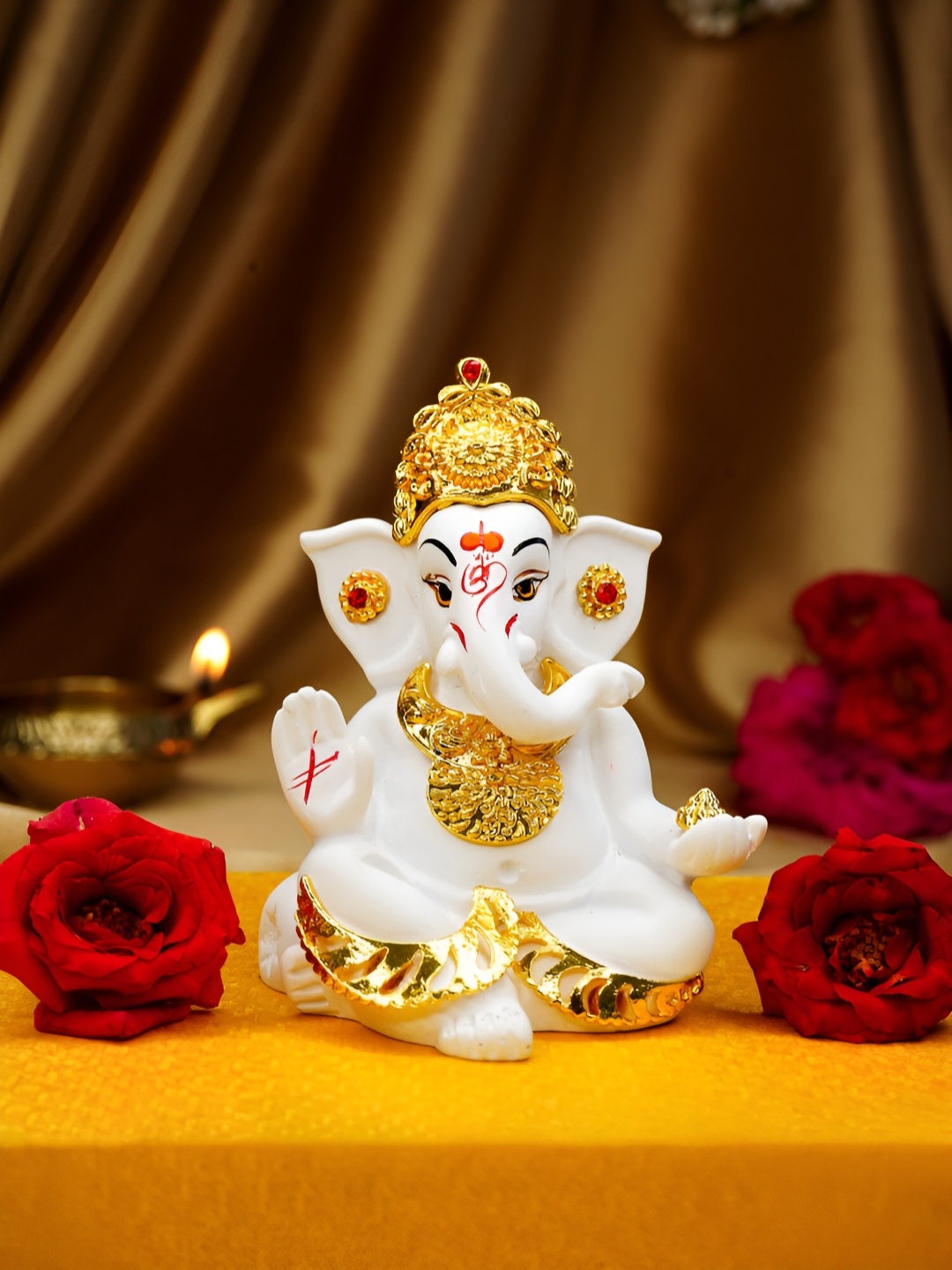 

Ekhasa White Tiny Ganesh Idol Religious Showpiece