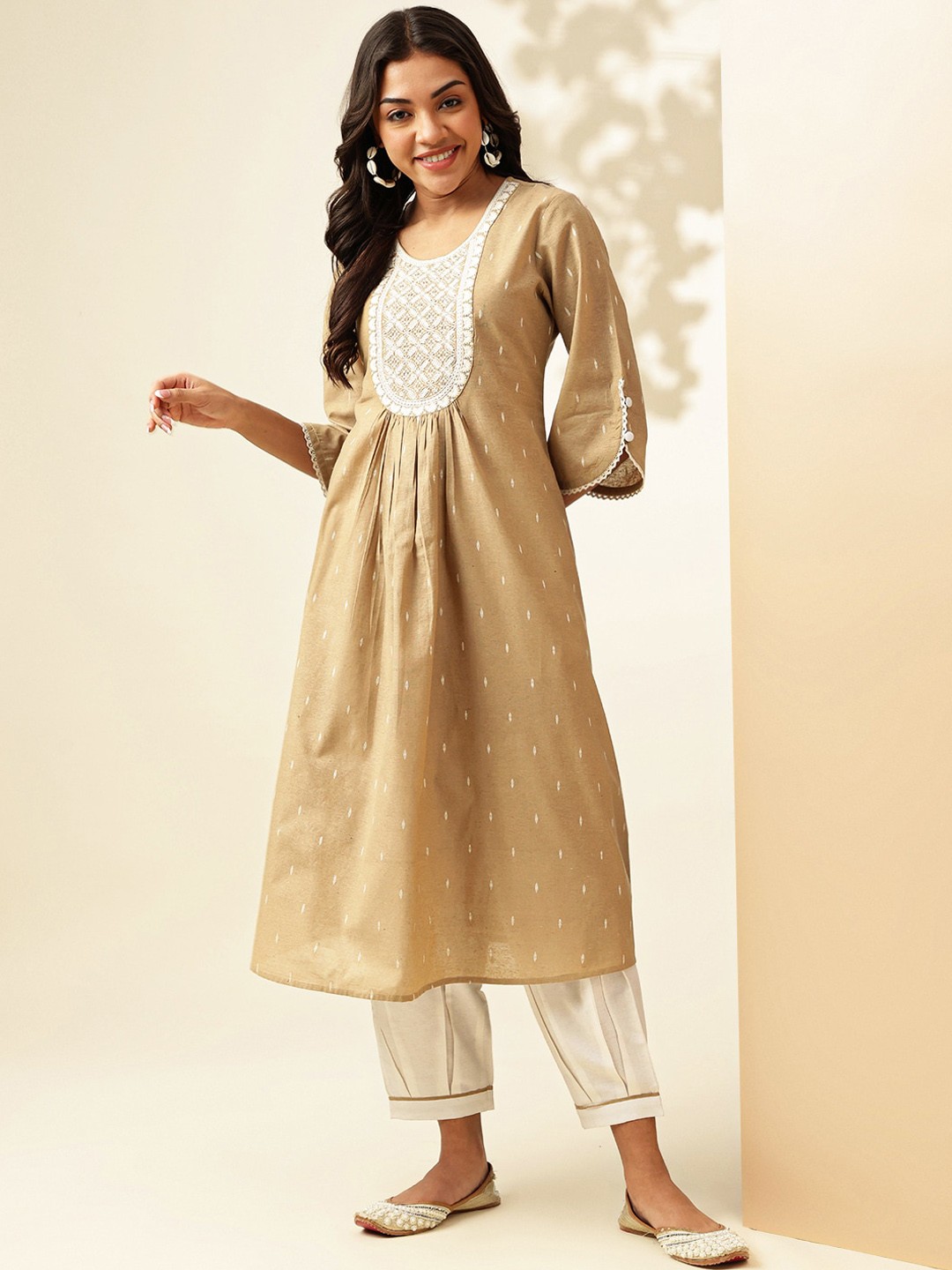 

Anouk Ethnic Motifs Embroidered Pleated Thread Work Cotton A-Line Kurta with Harem Trouser, Beige