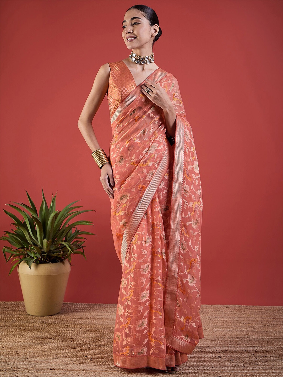 

Anouk Peach Woven Design Floral Printed Brasso Saree