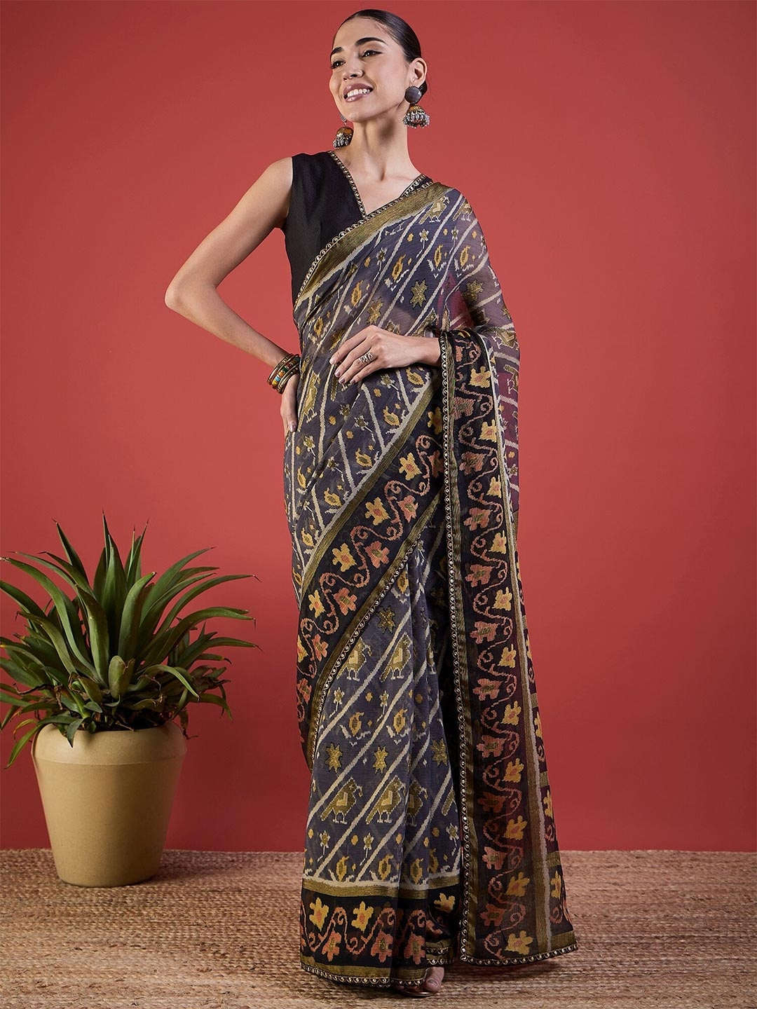 

Anouk Grey Ethnic Motifs Printed Brasso Patola Saree
