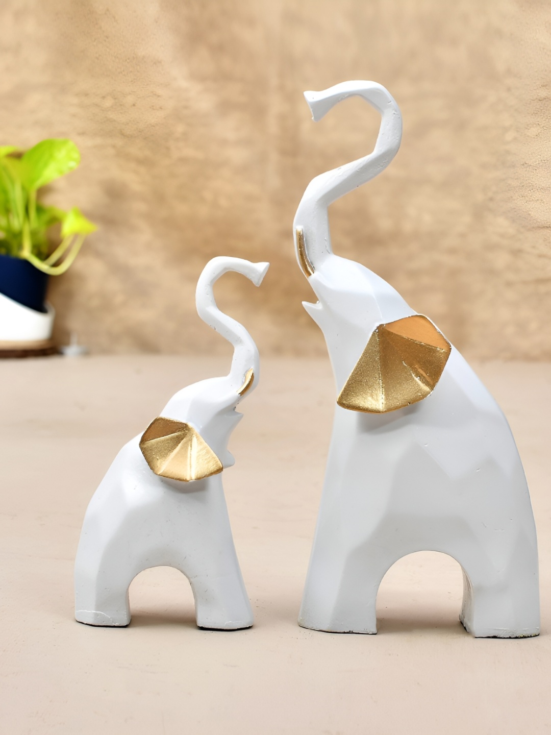 

Craft Junction White & Gold-Toned Polyresin Birds And Animals Small Idol Showpiece